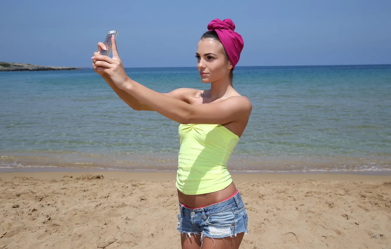 Photo wallpaper sea, sexy, brunette, shorts, phone, t-shirt, on the beach, selfie