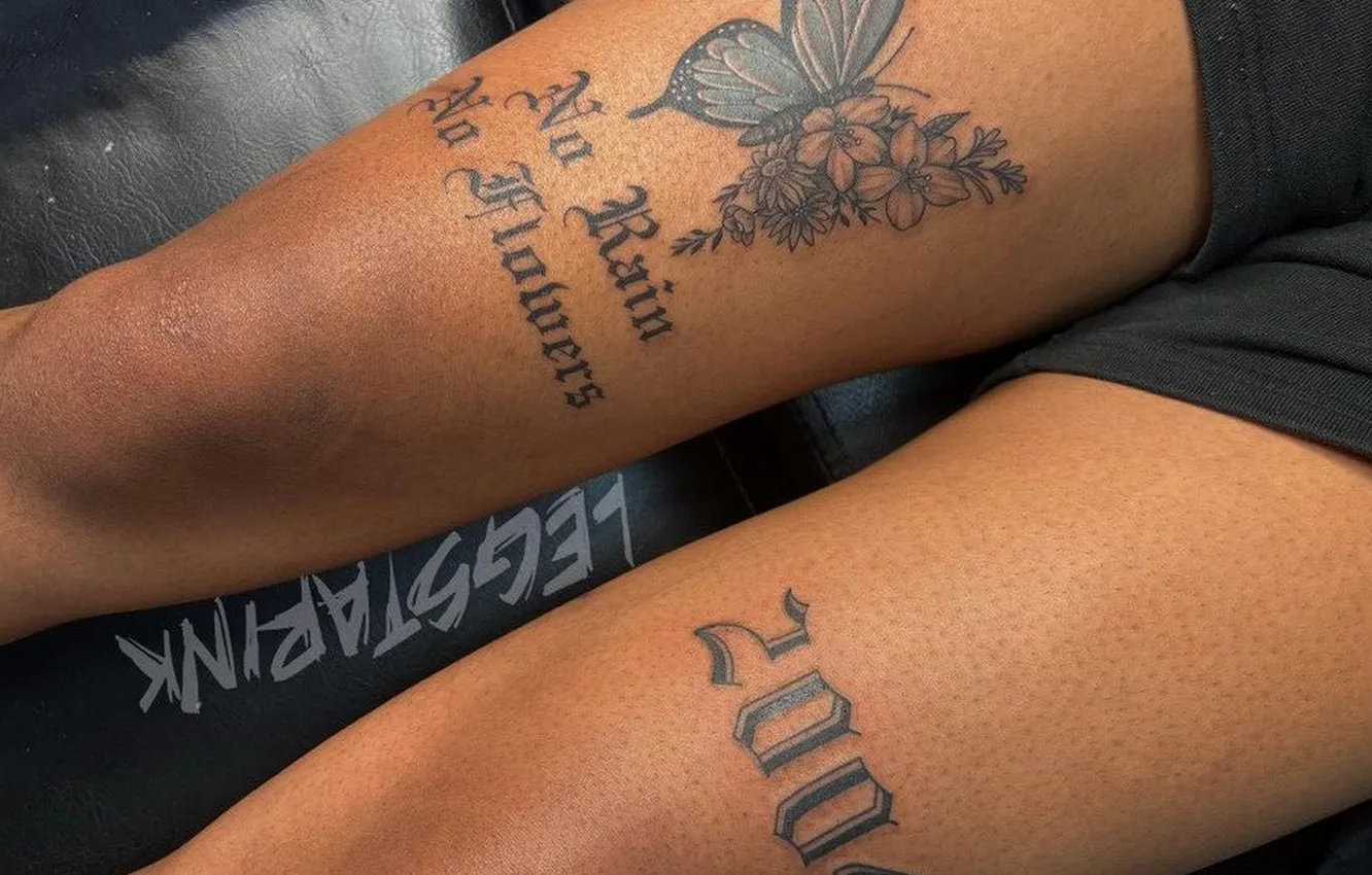 Photo wallpaper girl, tattoos on the legs, tanned legs