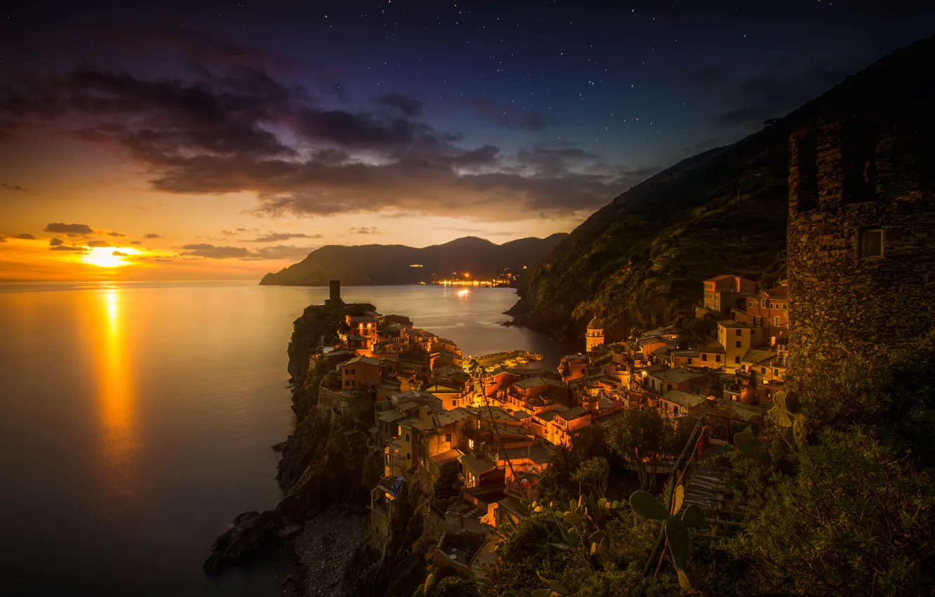 Photo wallpaper sea, sunset, mountains, lights, rocks, tower, home, the evening