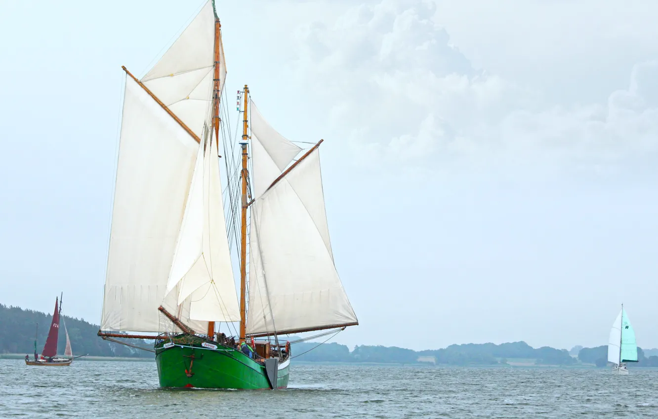 Photo wallpaper clouds, shore, sailboat