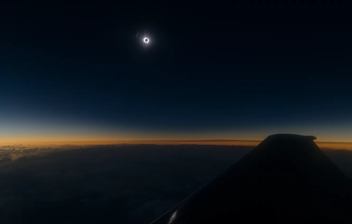 Photo wallpaper the sun, flight, the plane, The sky, wing, total Eclipse