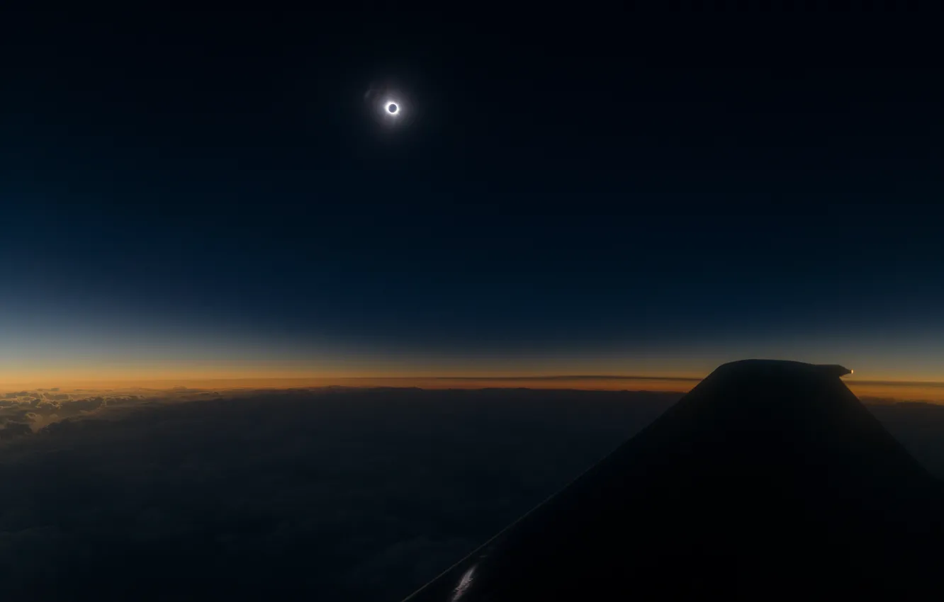 Photo wallpaper the sky, the sun, flight, wings, the plane, Total eclipse