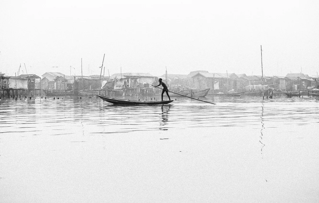 Photo wallpaper river, boy, canoe, poverty, stilt houses