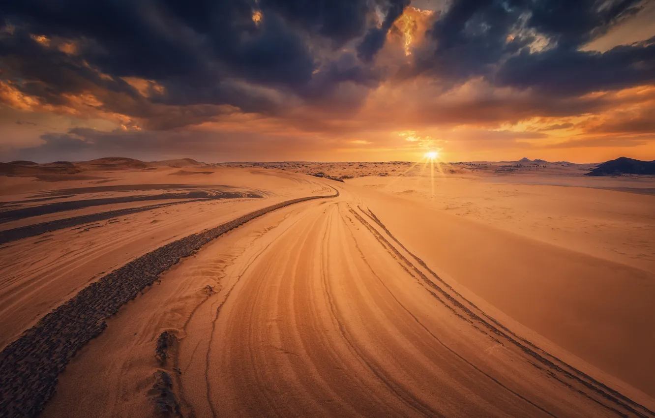 Photo wallpaper road, sand, the sky, the sun, rays, sunset, clouds, hills