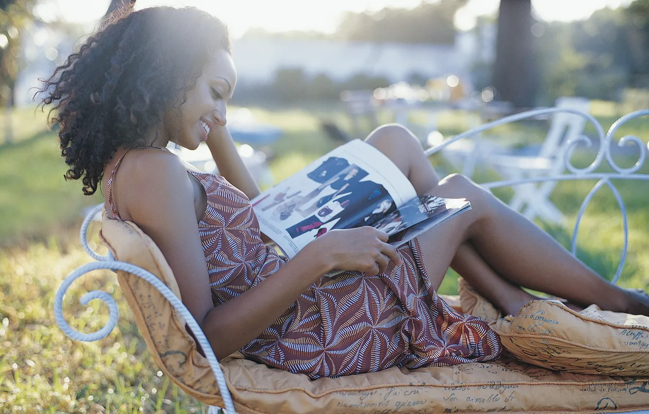 Photo wallpaper girl, bench, pillow, journal, sitting, curls, reads, smiling