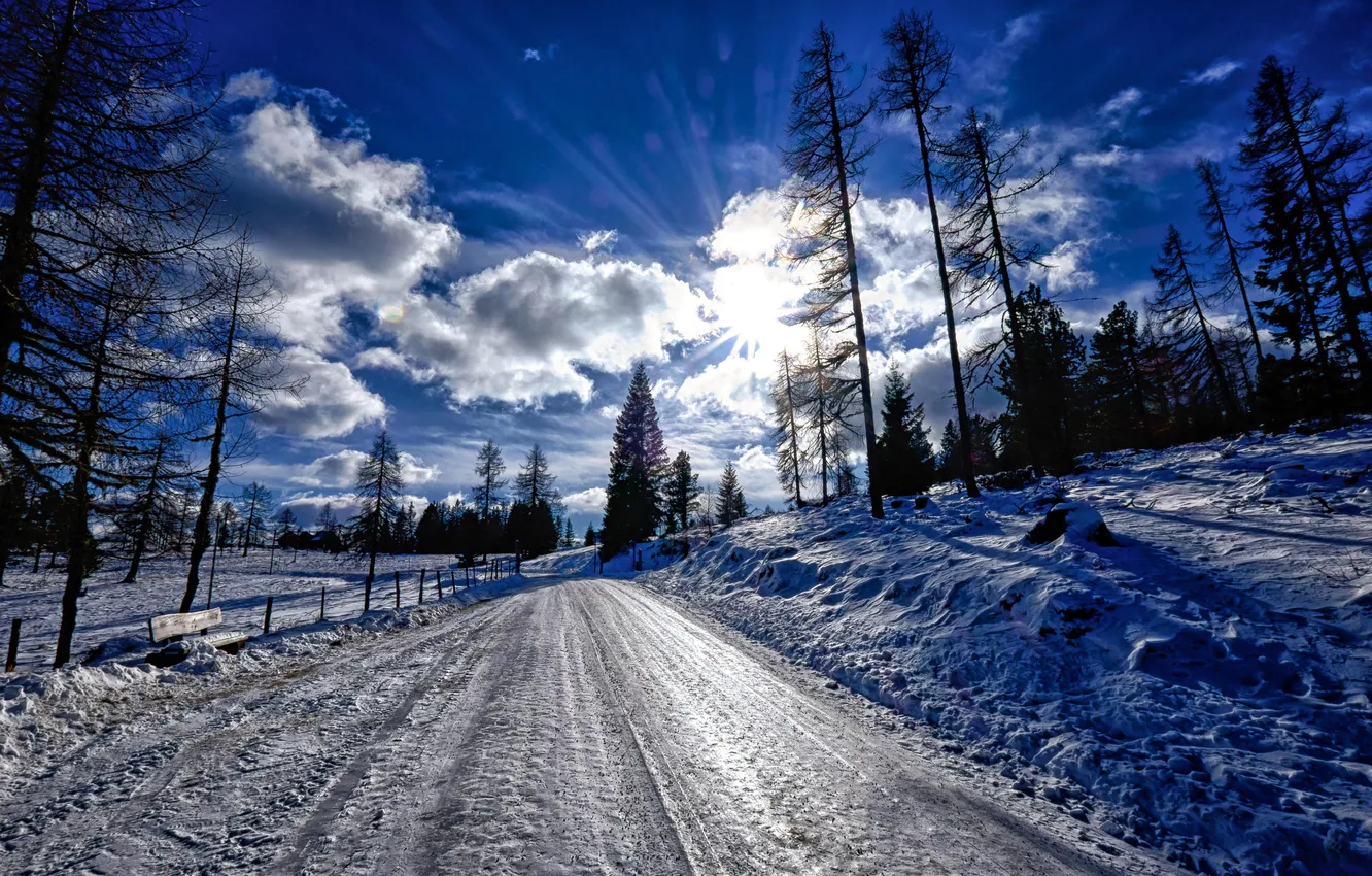 Photo wallpaper winter, road, forest, the sky, the sun, clouds, snow, trees