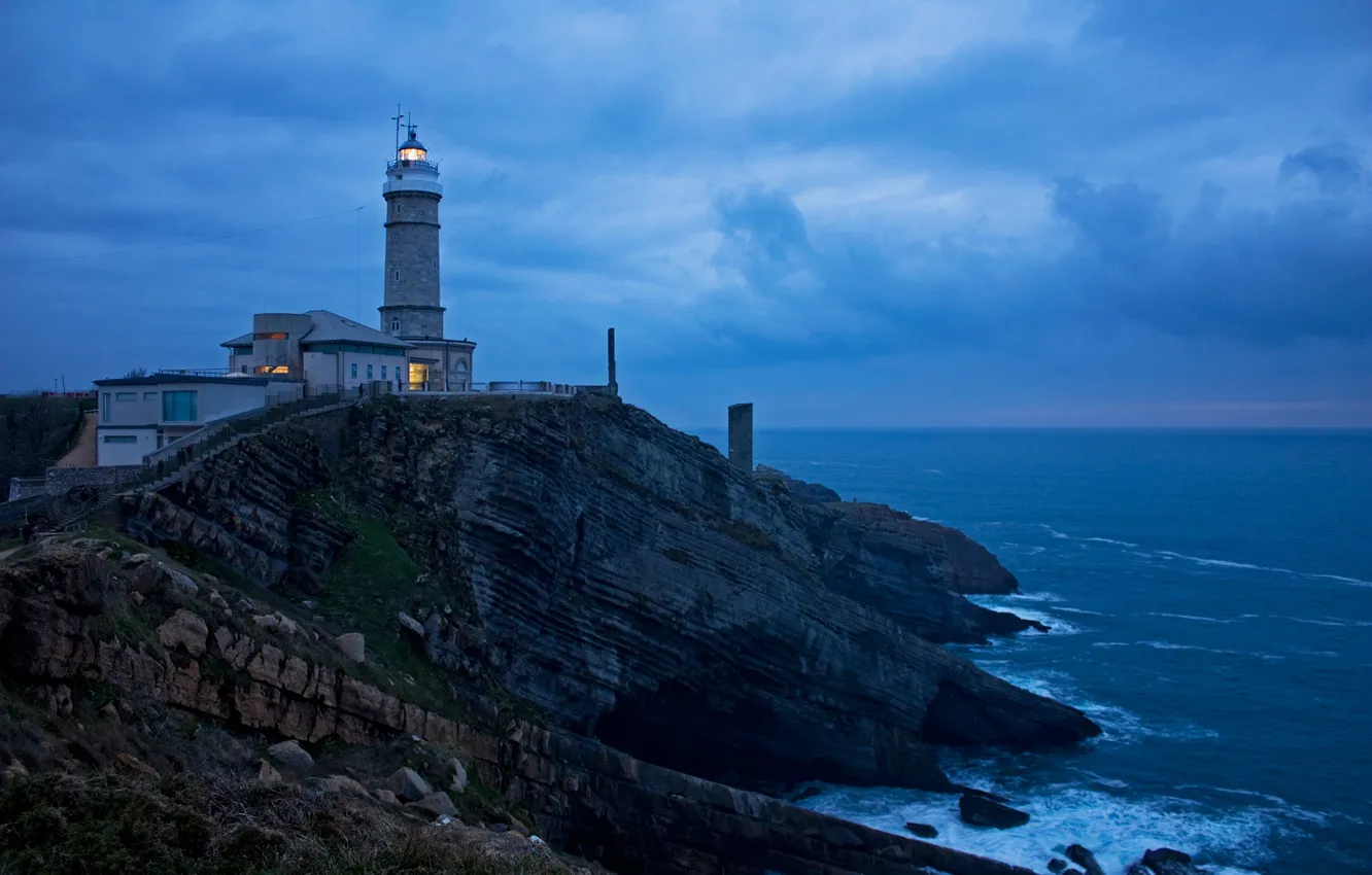 Photo wallpaper sea, stones, rocks, coast, lighthouse, the evening, horizon, Spain
