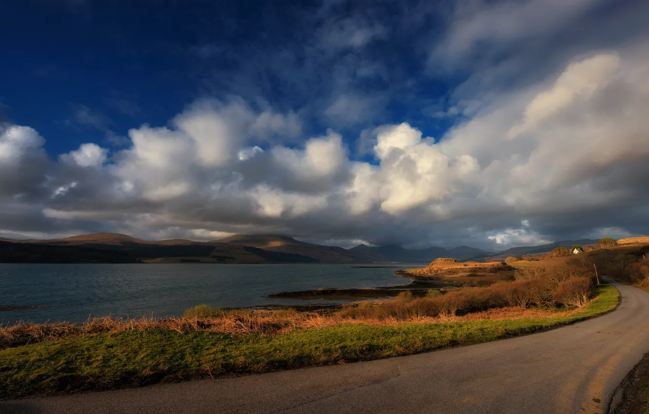 Photo wallpaper road, autumn, the sky, grass, clouds, light, mountains, orange