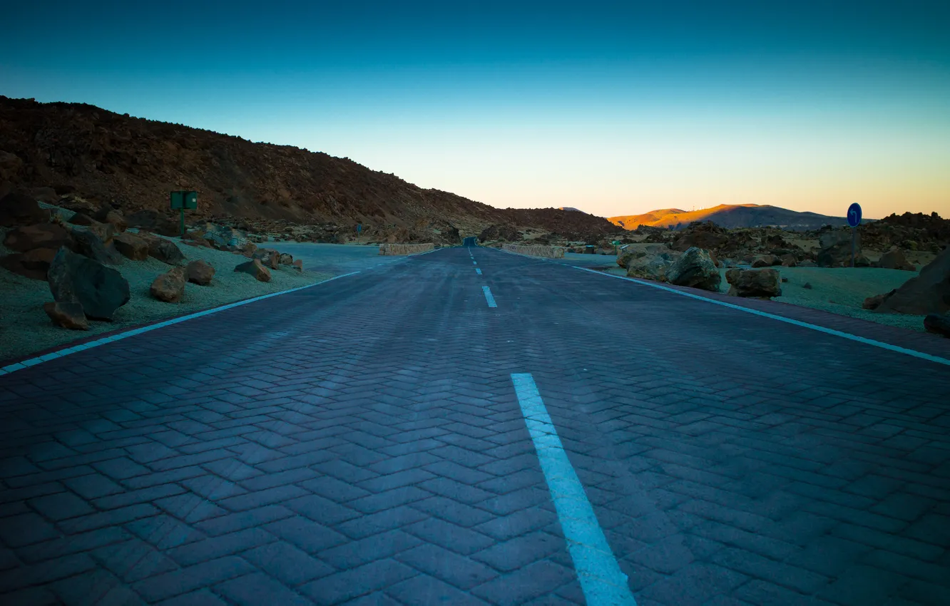 Photo wallpaper road, line, sunset, stones, hills
