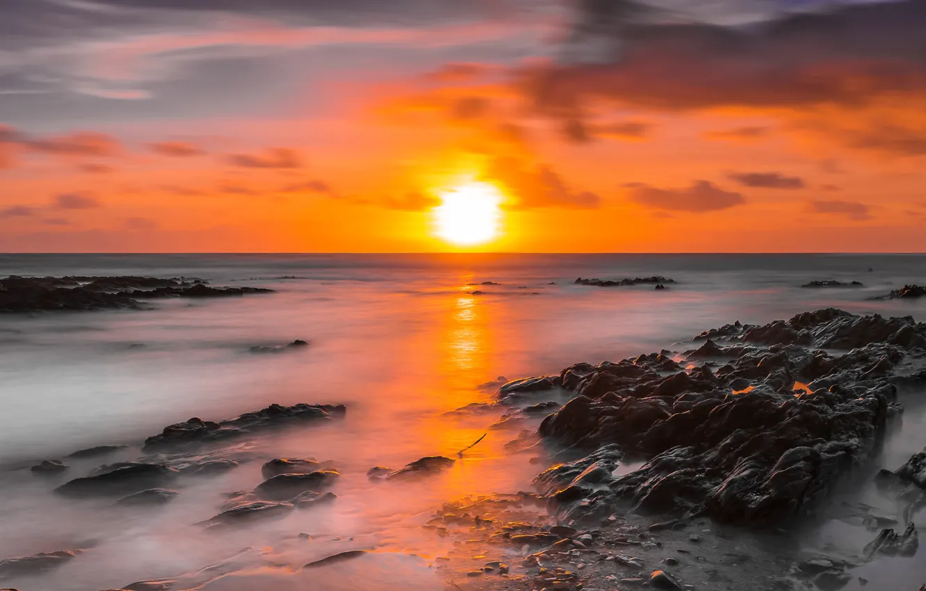Photo wallpaper sea, the sun, clouds, light, sunset, orange, glare, stones