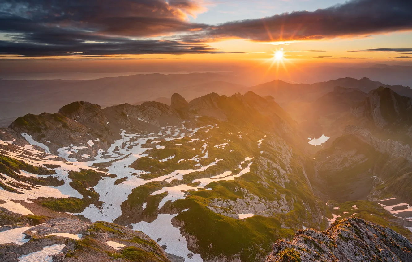 Photo wallpaper the sun, clouds, rays, light, snow, sunset, mountains, clouds