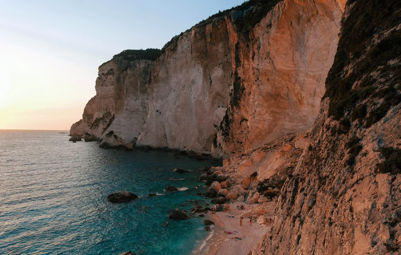 Photo wallpaper sunset, the ocean, rocks, coast, Greece, ocean, coast, sunset