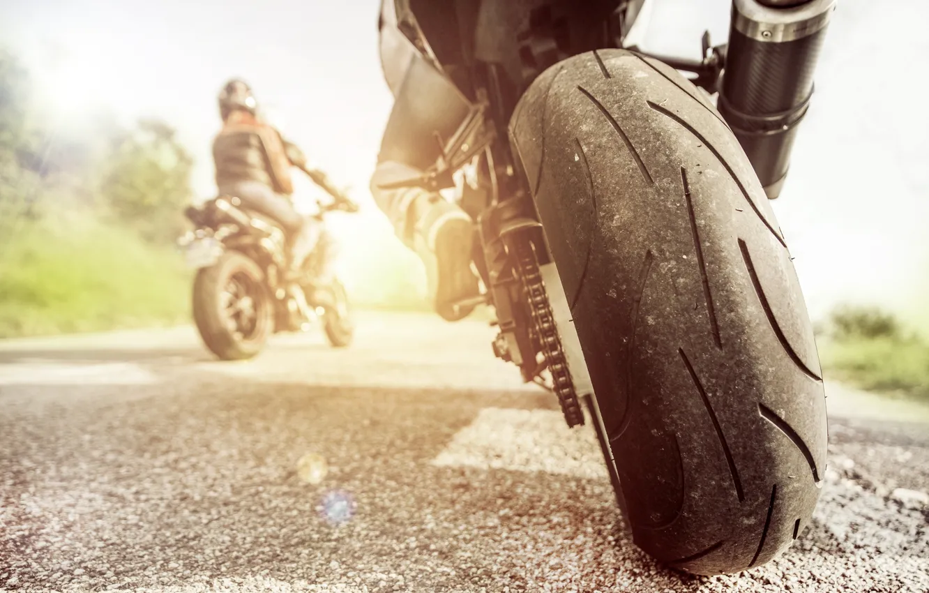 Photo wallpaper road, asphalt, the sun, motorcycle, tires, biker, bokeh