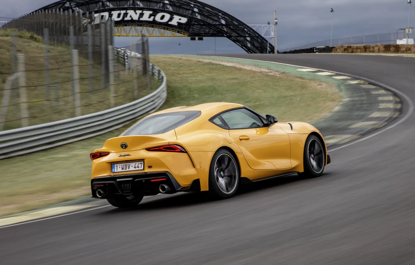Photo wallpaper yellow, lawn, coupe, speed, track, turn, Toyota, Supra