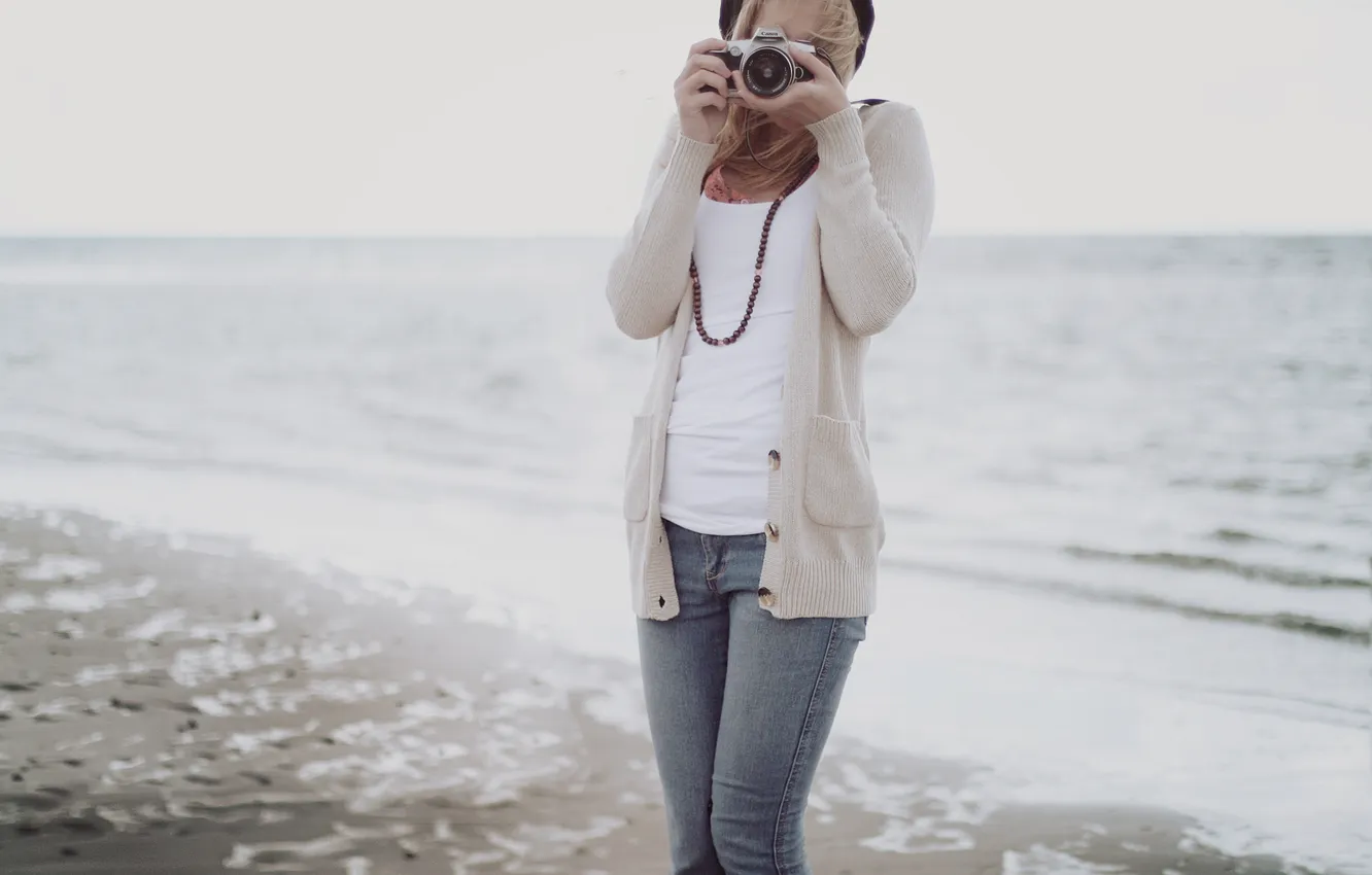 Photo wallpaper sea, girl, the wind, jeans, the camera, blonde, beads, blouse