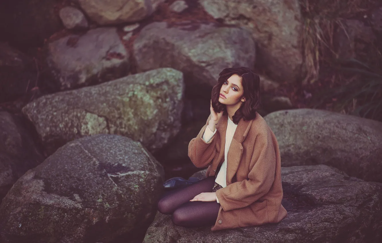 Photo wallpaper girl, stones, sitting, coat