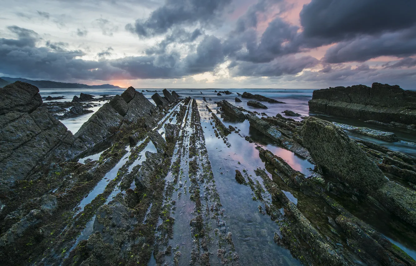 Photo wallpaper sea, clouds, sunset, stones, rocks, shore, dal, rocky shore