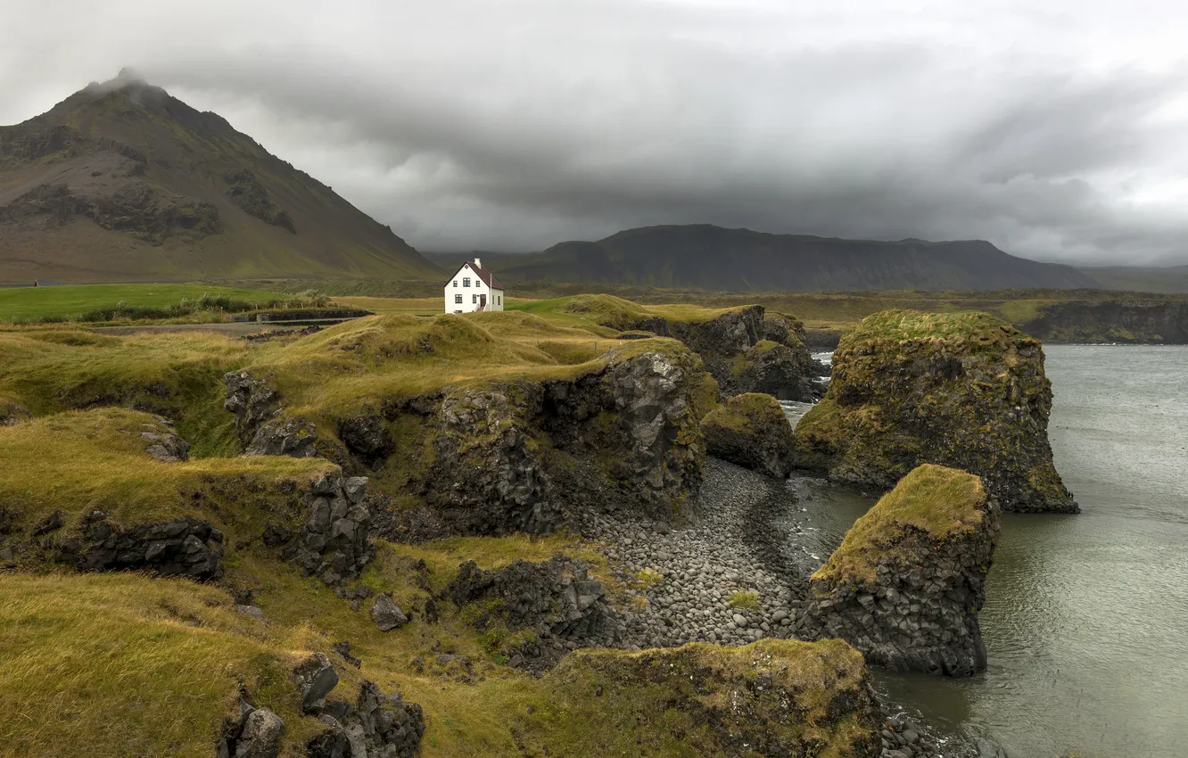 Photo wallpaper the storm, mountains, house, rocks, coat, Iceland, gray clouds, rainy