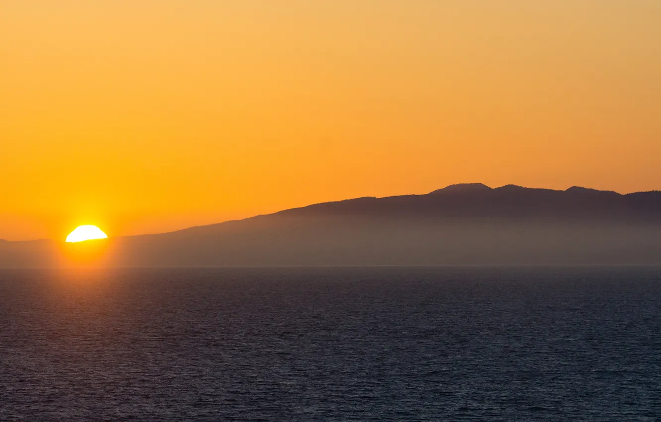 Photo wallpaper sea, mountains, fog, sunrise, yellow sky