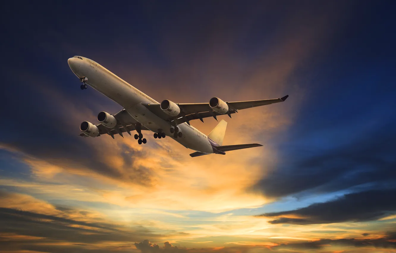 Photo wallpaper clouds, glow, the plane, in the sky, passenger, Flies