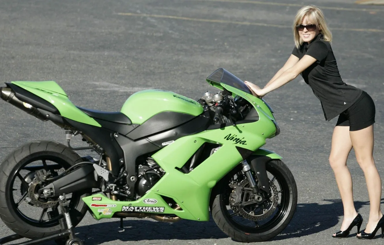 Photo wallpaper road, look, girl, glasses, blonde, beautiful girl, standing over a green KAWASAKI motorcycle