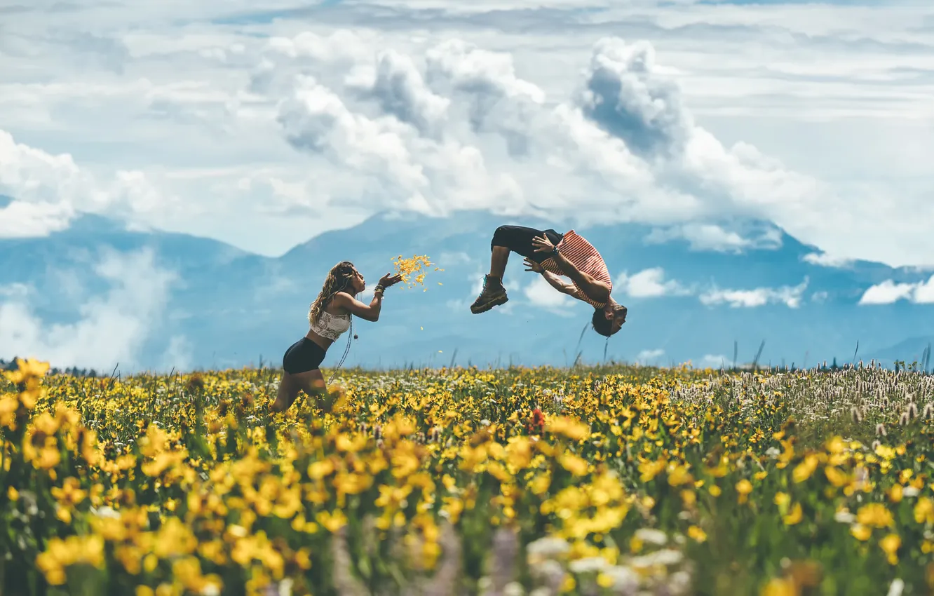 Photo wallpaper field, girl, jump, guy, flight