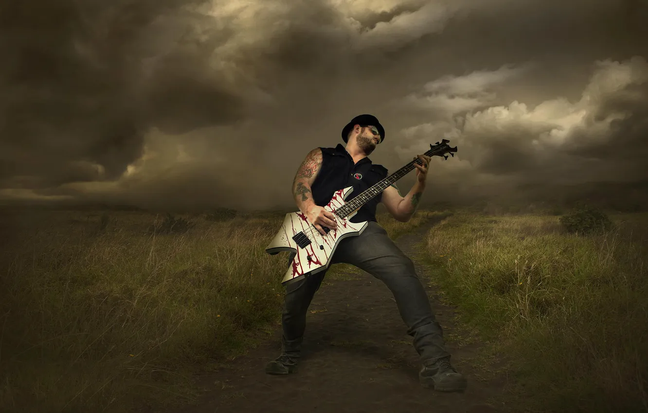 Photo wallpaper clouds, storm, guitarist, rock