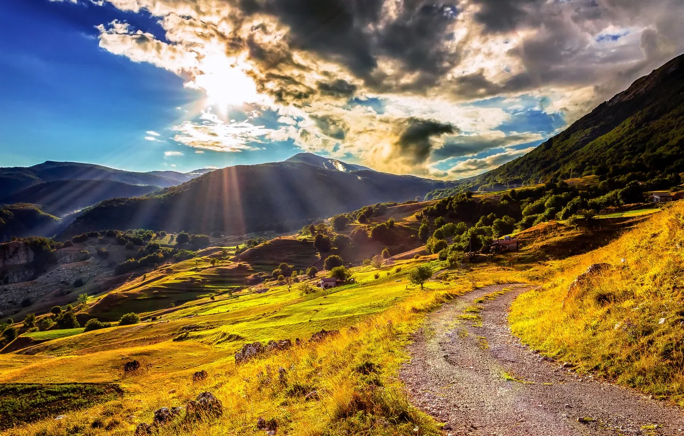 Photo wallpaper the sky, the sun, clouds, rays, mountains, field, trail, slope