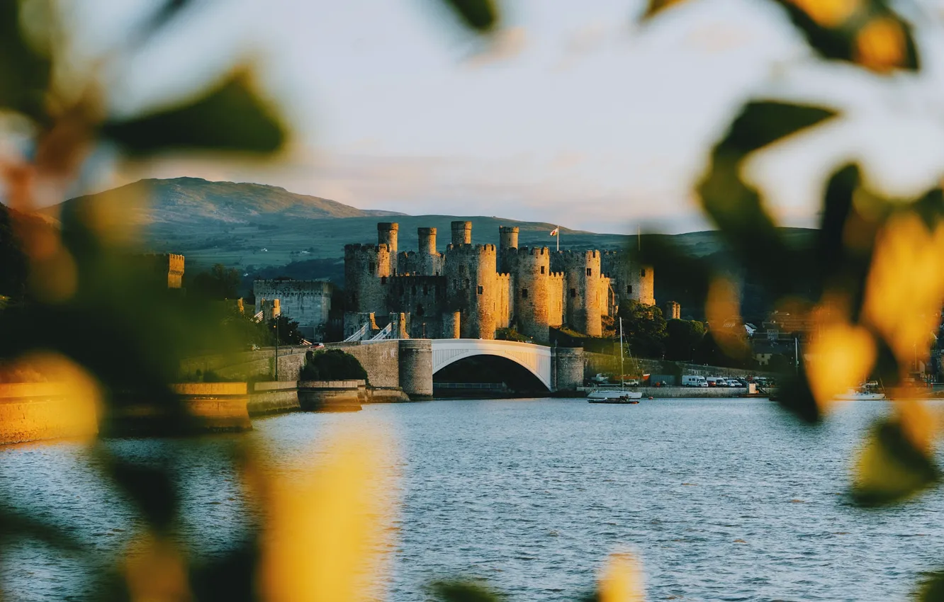 Photo wallpaper autumn, the sky, leaves, light, bridge, castle, hills, shore