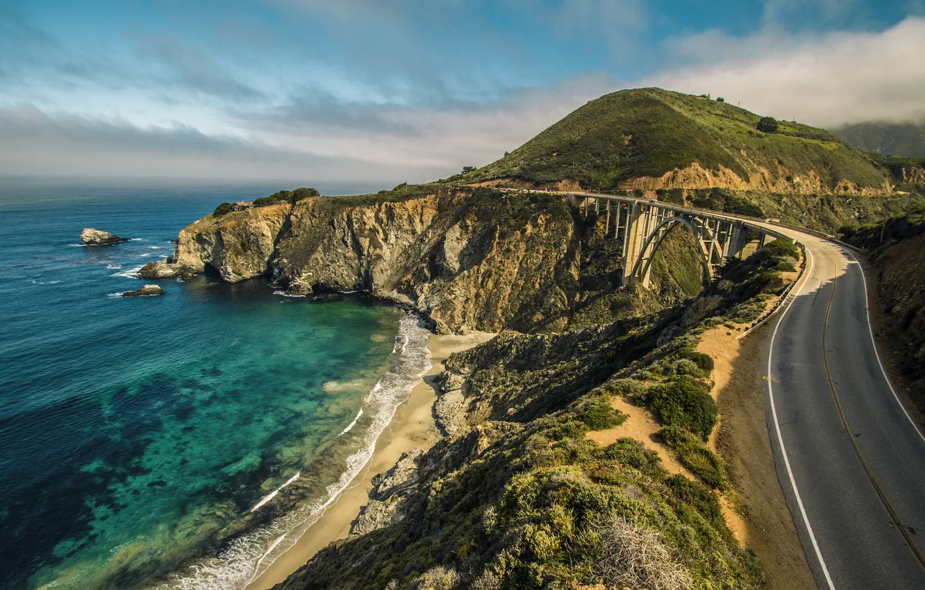 Photo wallpaper road, sea, the sky, clouds, mountains, bridge