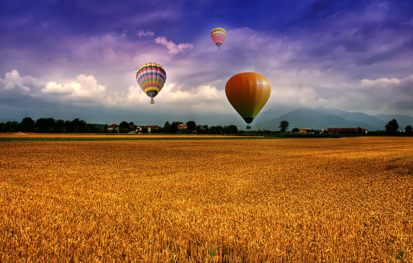 Photo wallpaper the sky, clouds, mountains, balloons, Field, houses, the village