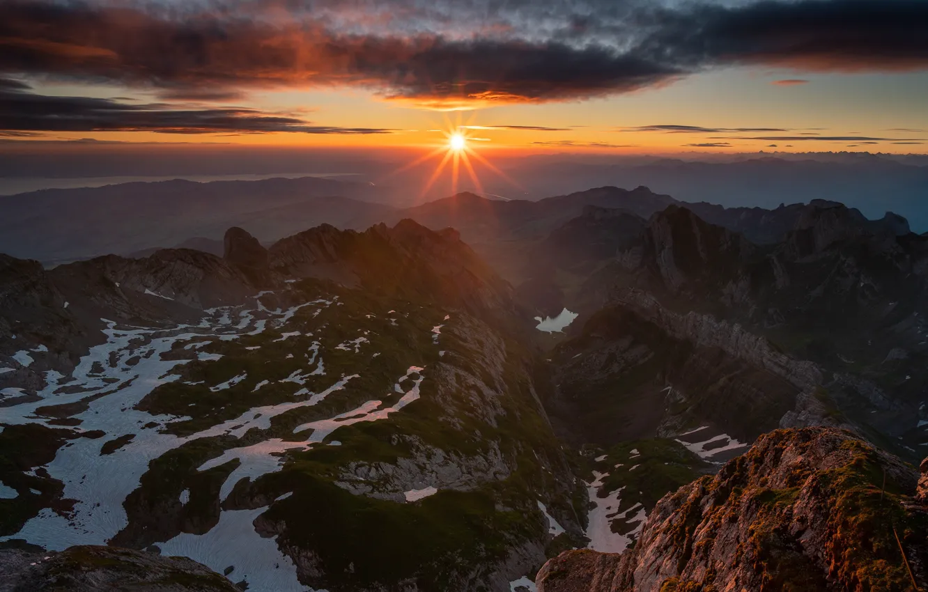 Photo wallpaper the sky, the sun, rays, snow, sunset, mountains, clouds, rocks