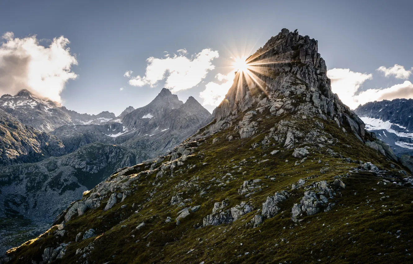 Photo wallpaper the sun, clouds, rays, light, mountains, stones, rocks, the slopes