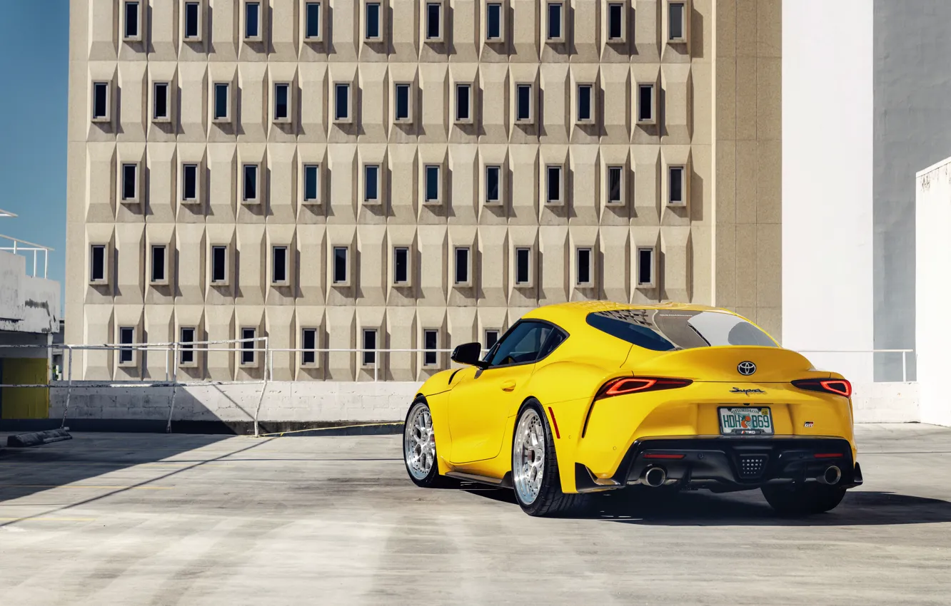 Photo wallpaper yellow, sports car, rear view, Toyota Supra, 2020 Toyota GR Above