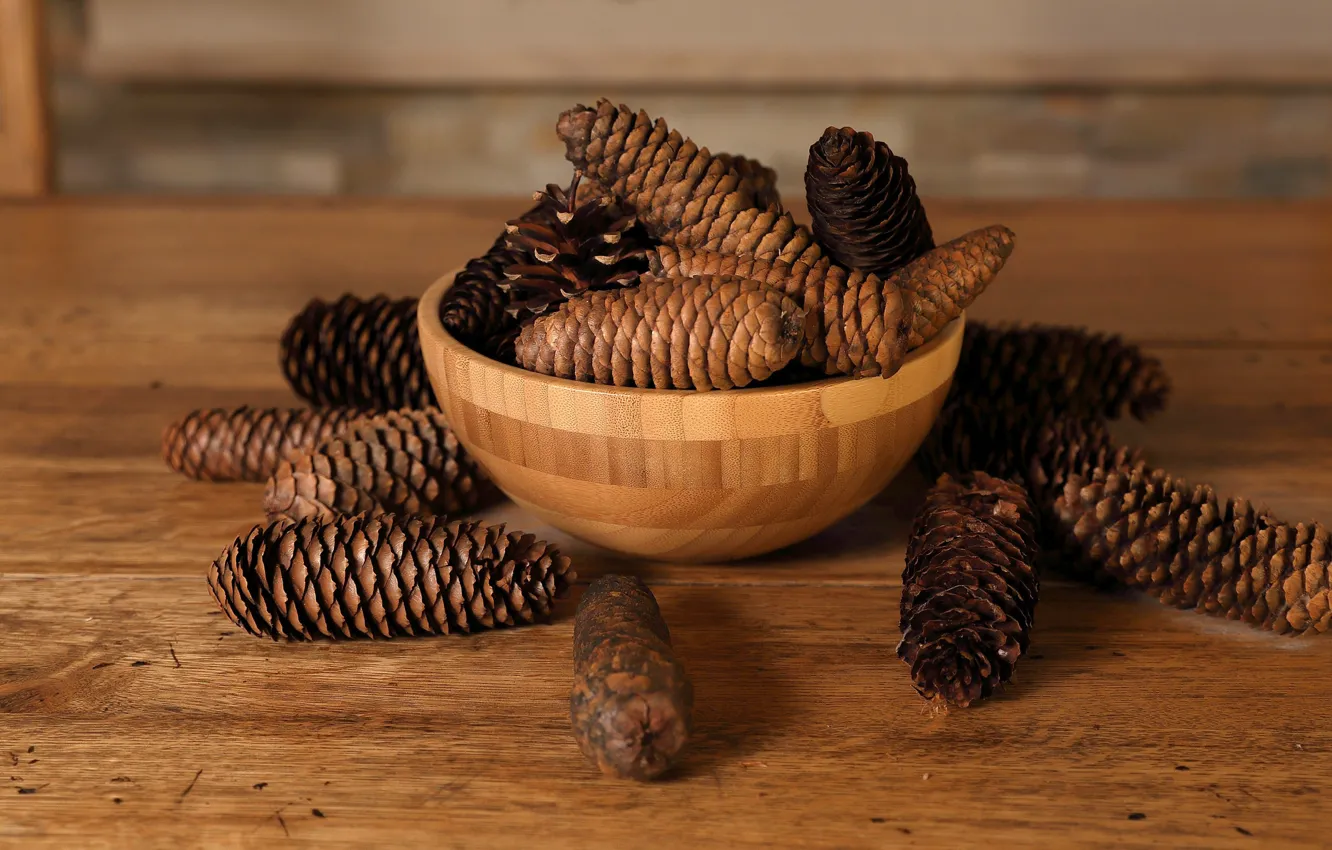 Photo wallpaper pine cones, table top, wood table, wood bowl