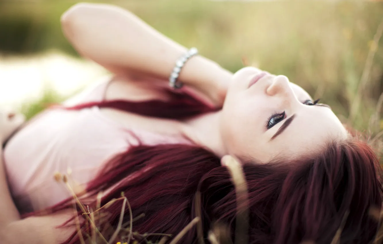 Photo wallpaper grass, look, girl, lies, red hair, looks, girl in the grass