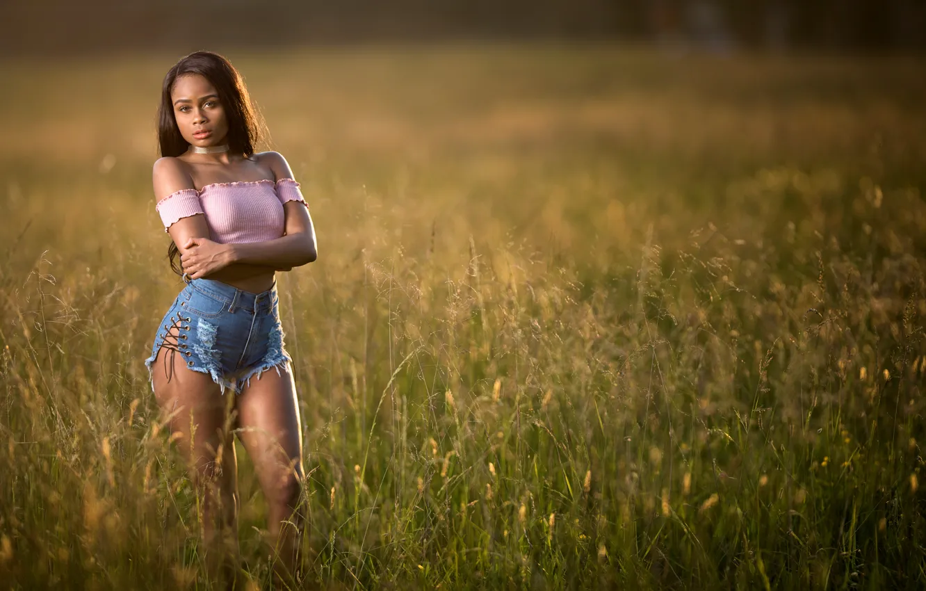 Photo wallpaper grass, girl, pose, shorts, figure, meadow