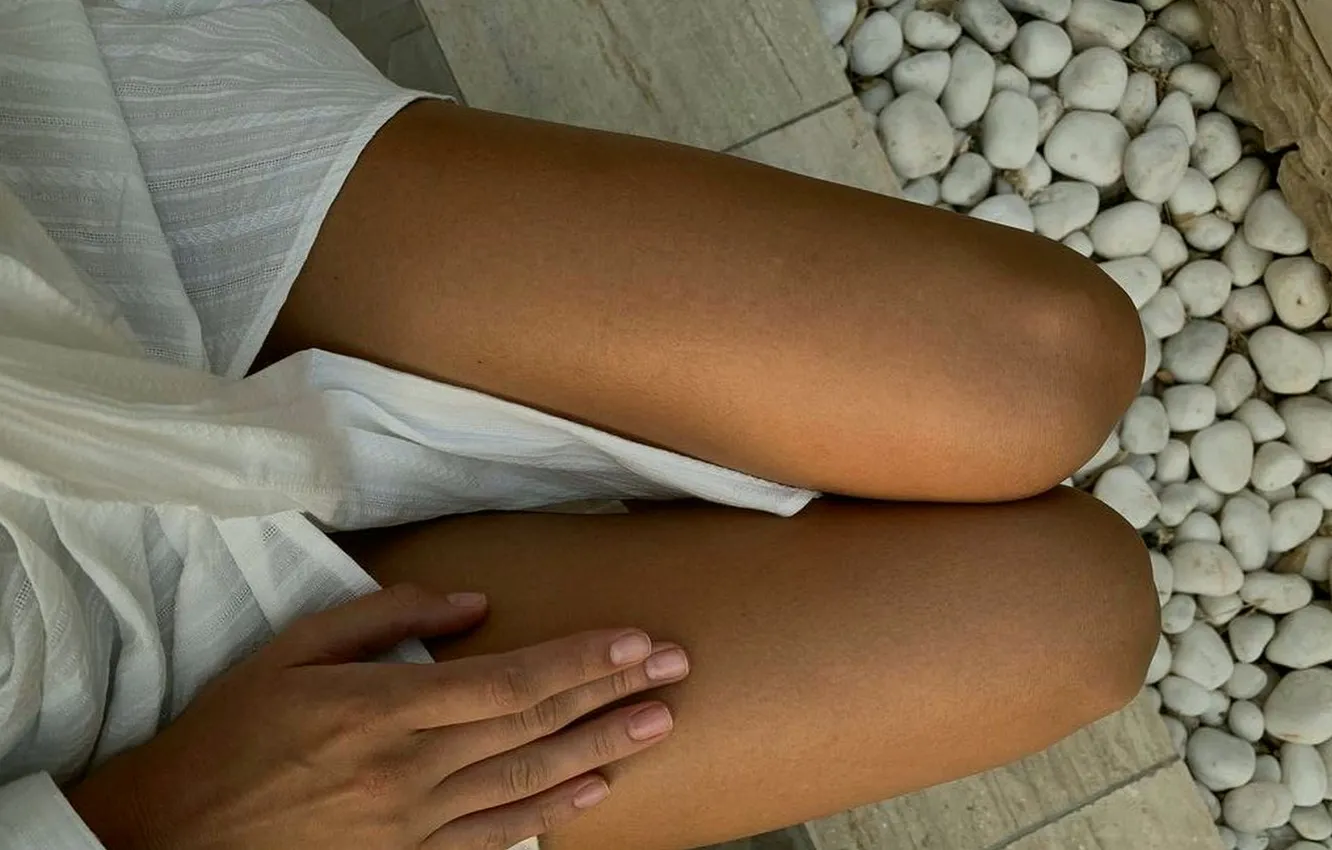 Photo wallpaper girl, pebbles, white dress, stones, manicure, slender legs, tanned legs