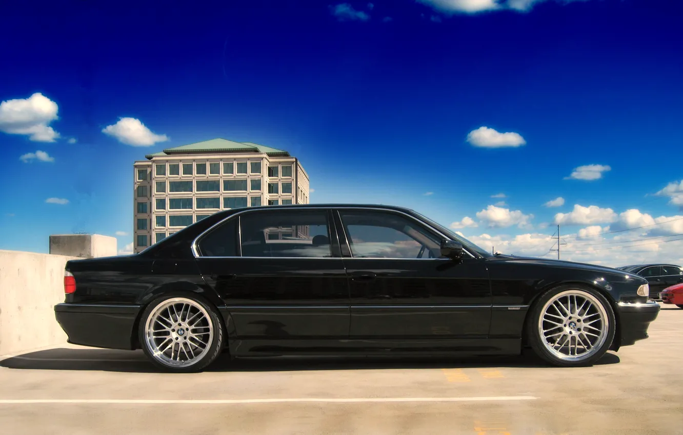 Photo wallpaper the sky, clouds, black, blue, bmw, BMW, Parking, concrete