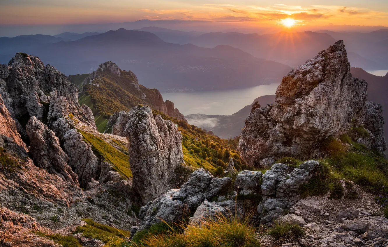 Photo wallpaper the sun, rays, sunset, mountains, fog, river, stones, rocks