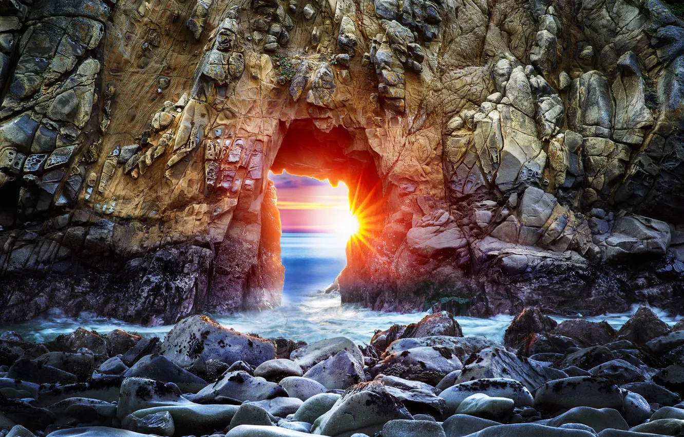 Photo wallpaper sea, the sun, rays, sunset, lights, stones, rocks, view