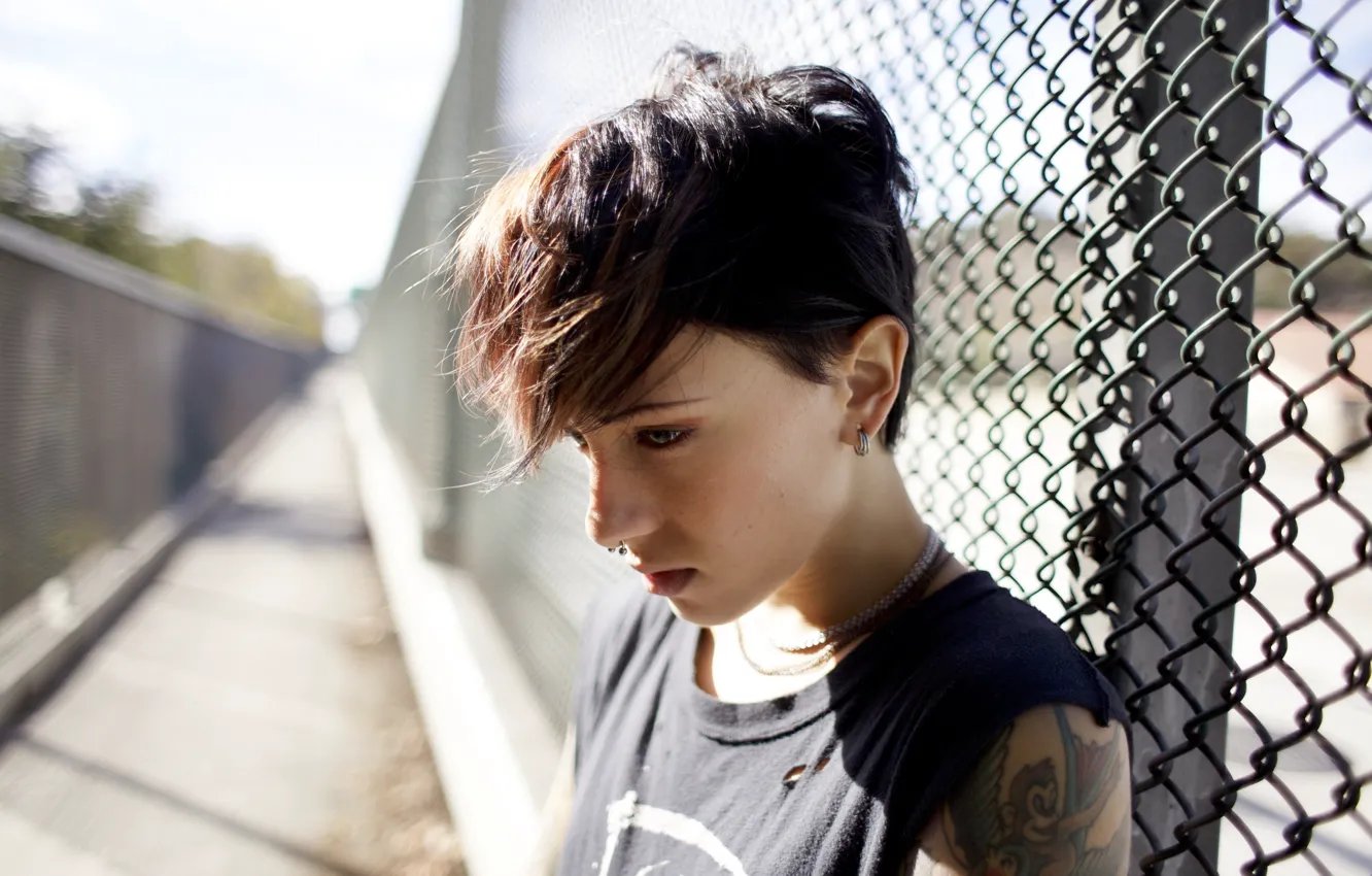 Photo wallpaper girl, woman, model, mood, fence, tattoo, bokeh, brunette