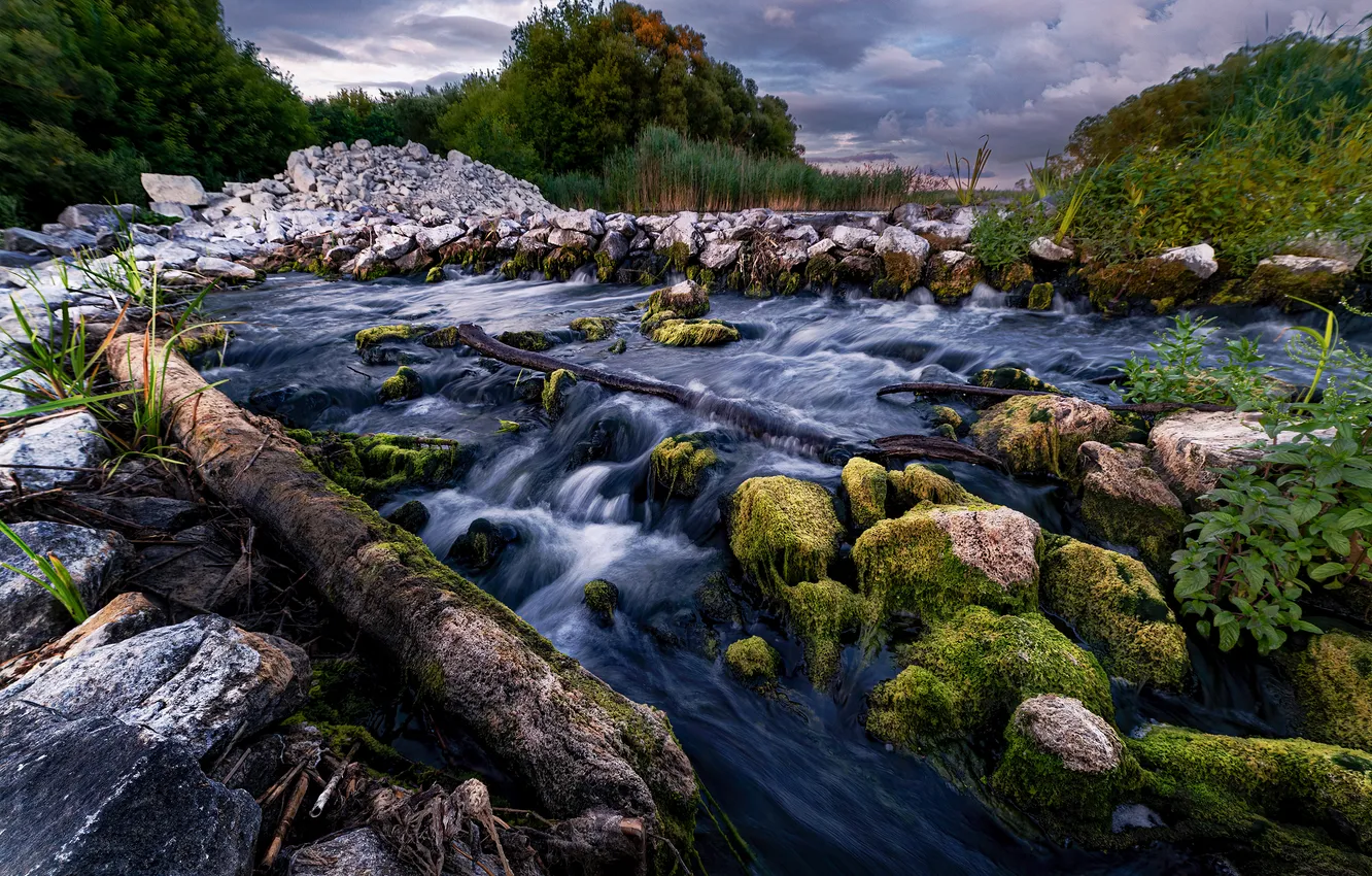 Photo wallpaper grass, clouds, stones, horizon, river, the flow of water, boulders, the beauty of nature
