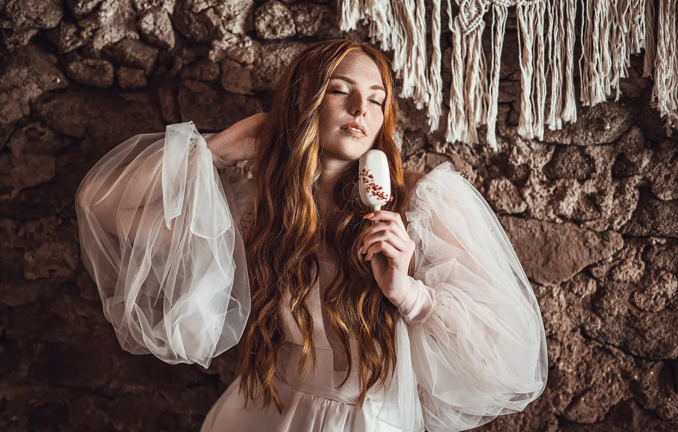 Photo wallpaper girl, pose, stones, wall, ice cream, white dress, redhead