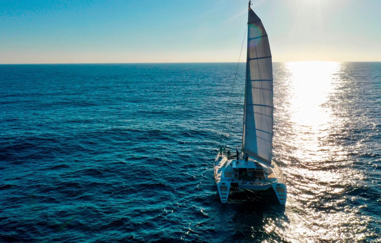 Photo wallpaper the sun, reflection, the way, the ocean, horizon, top, sail, catamaran