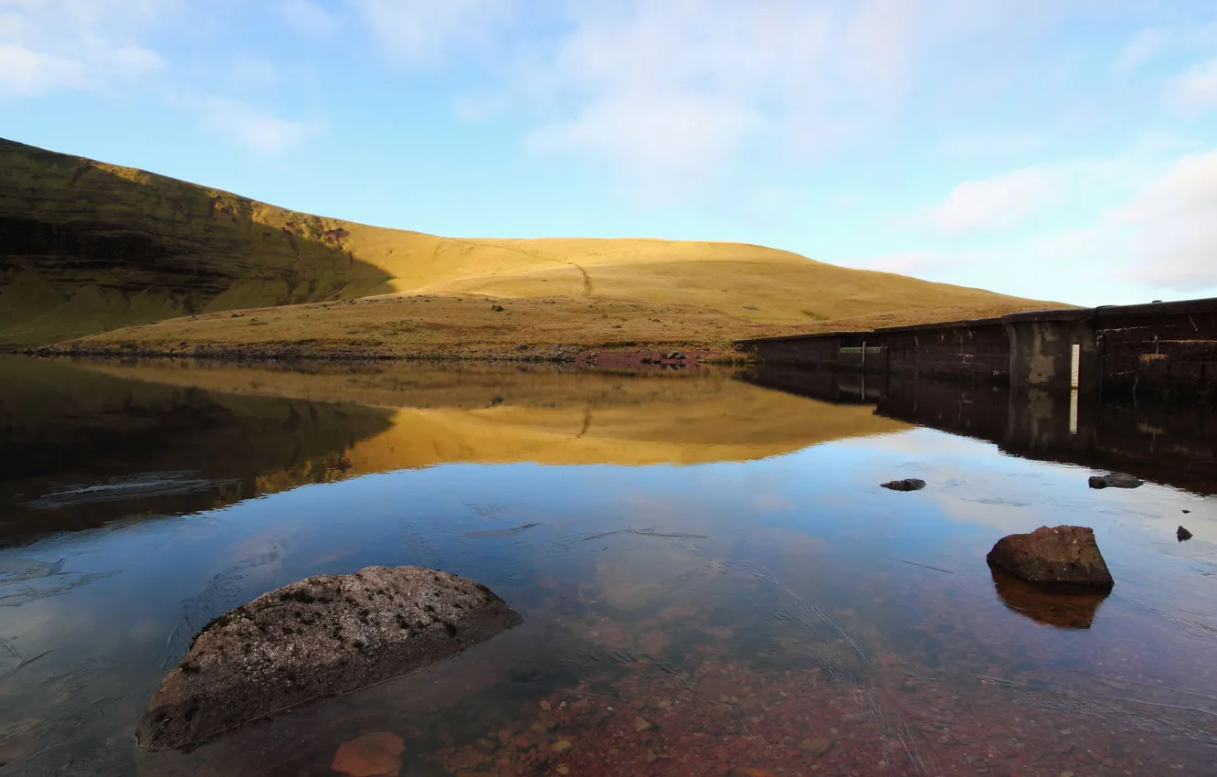 Photo wallpaper greens, water, lake, stones, hills, dam