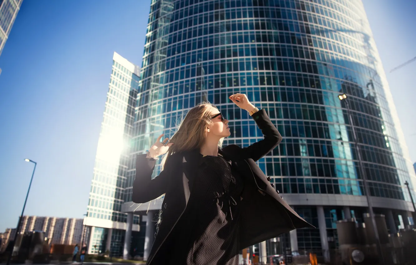 Photo wallpaper girl, the sun, the city, pose, hair, skyscrapers, coat, Denis Zimasco