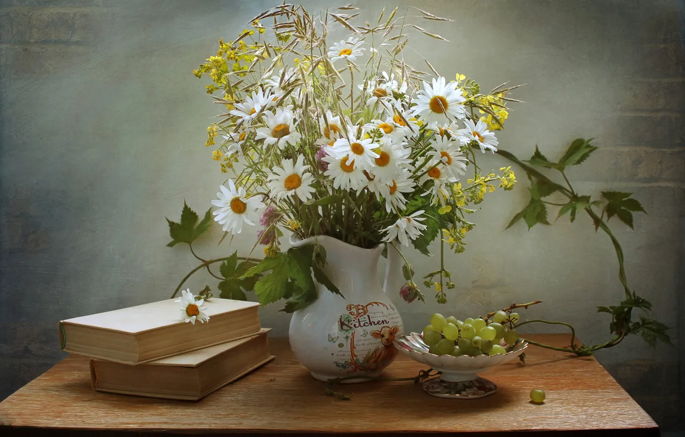Photo wallpaper table, wall, chamomile, bouquet, grapes, book, vase, pitcher