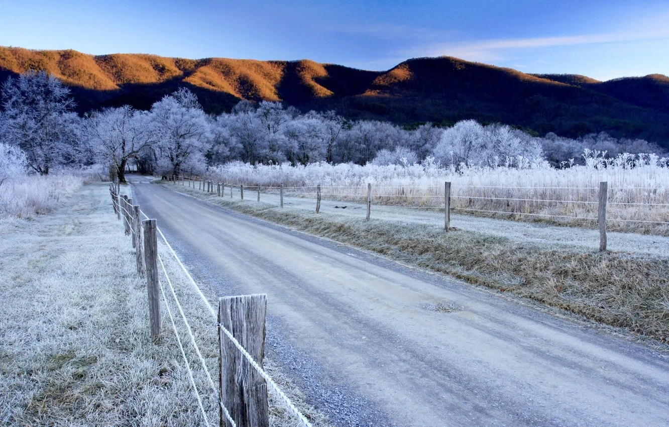 Photo wallpaper winter, frost, road, the sky, trees, mountains, the fence
