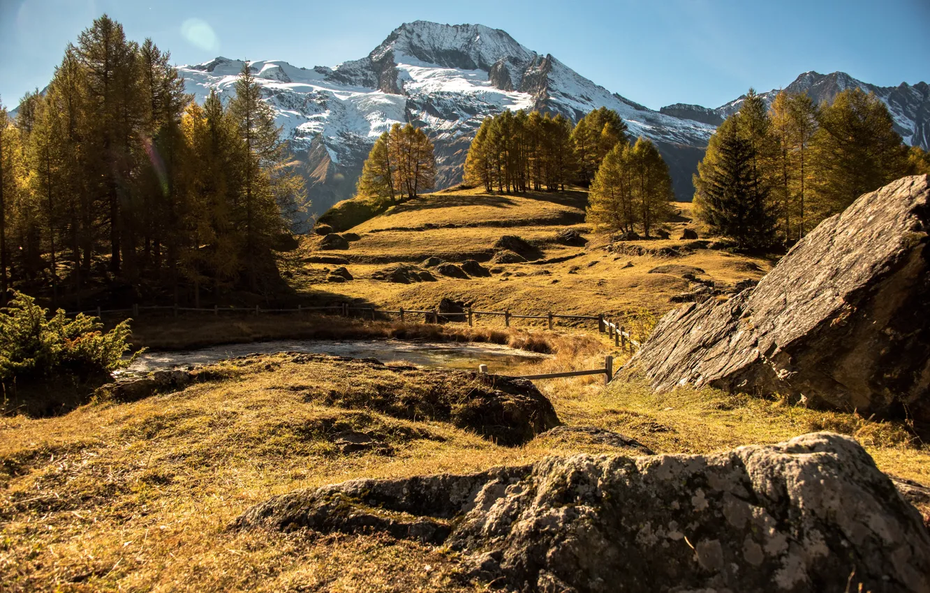 Photo wallpaper autumn, the sun, trees, mountains, stones, France, fence, Le Monal